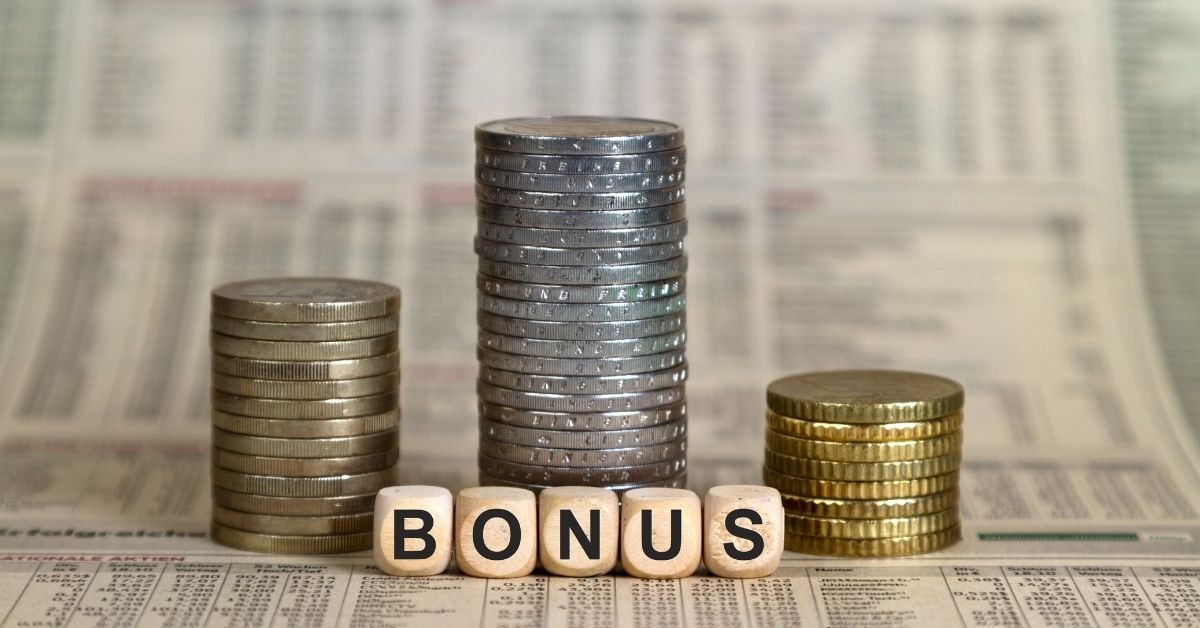 Stacks of coins with the word "BONUS" spelled out in blocks, symbolizing financial growth and the use of a bonus tax estimator to calculate earnings accurately.