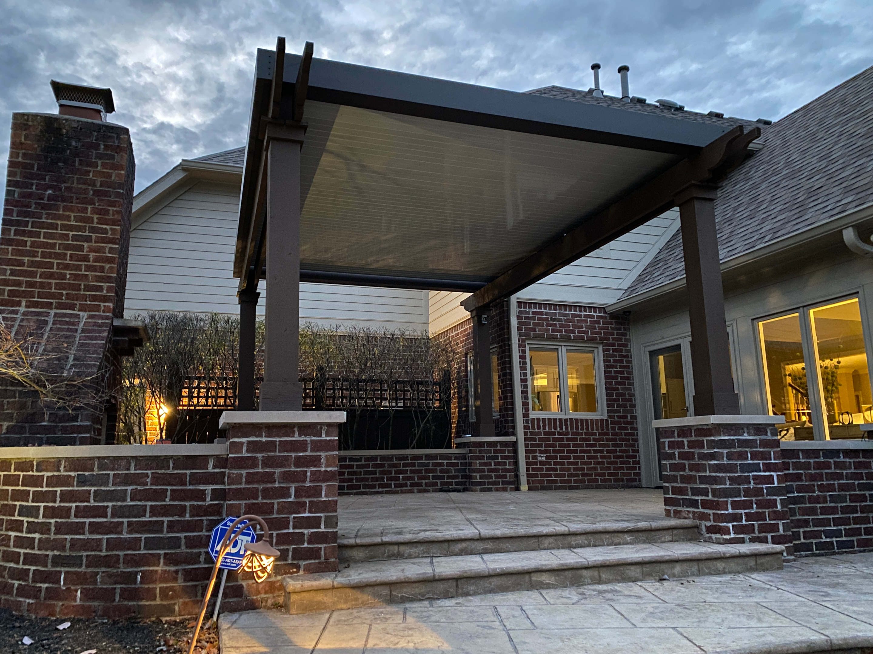 Bronze pergola with louvered roof