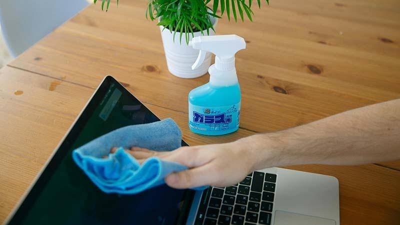 Use a glass cleaner and microfiber for your laptop screen