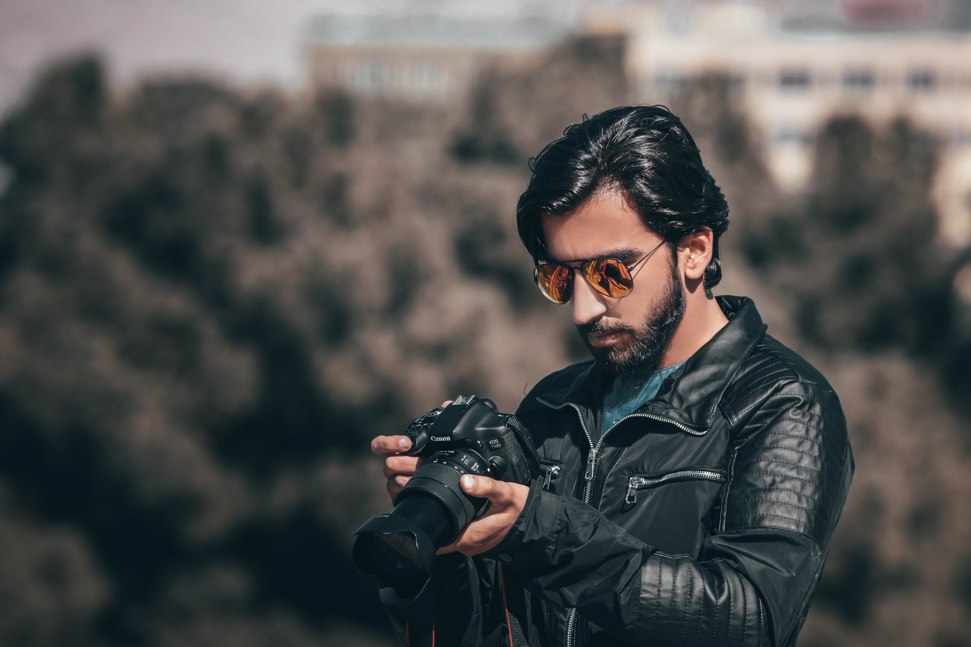Man in Leather Jacket Looking at His Camera
