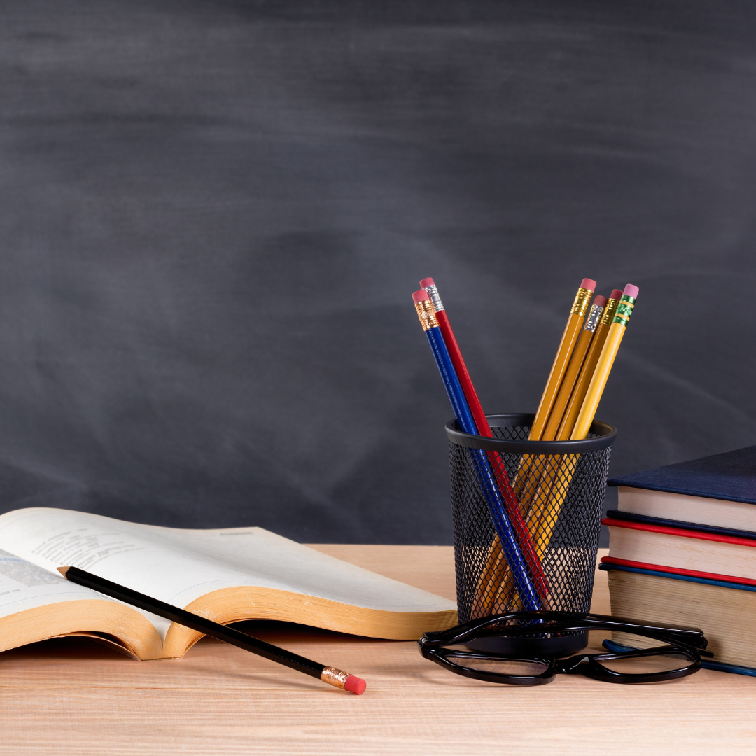 pencils and books on a desk