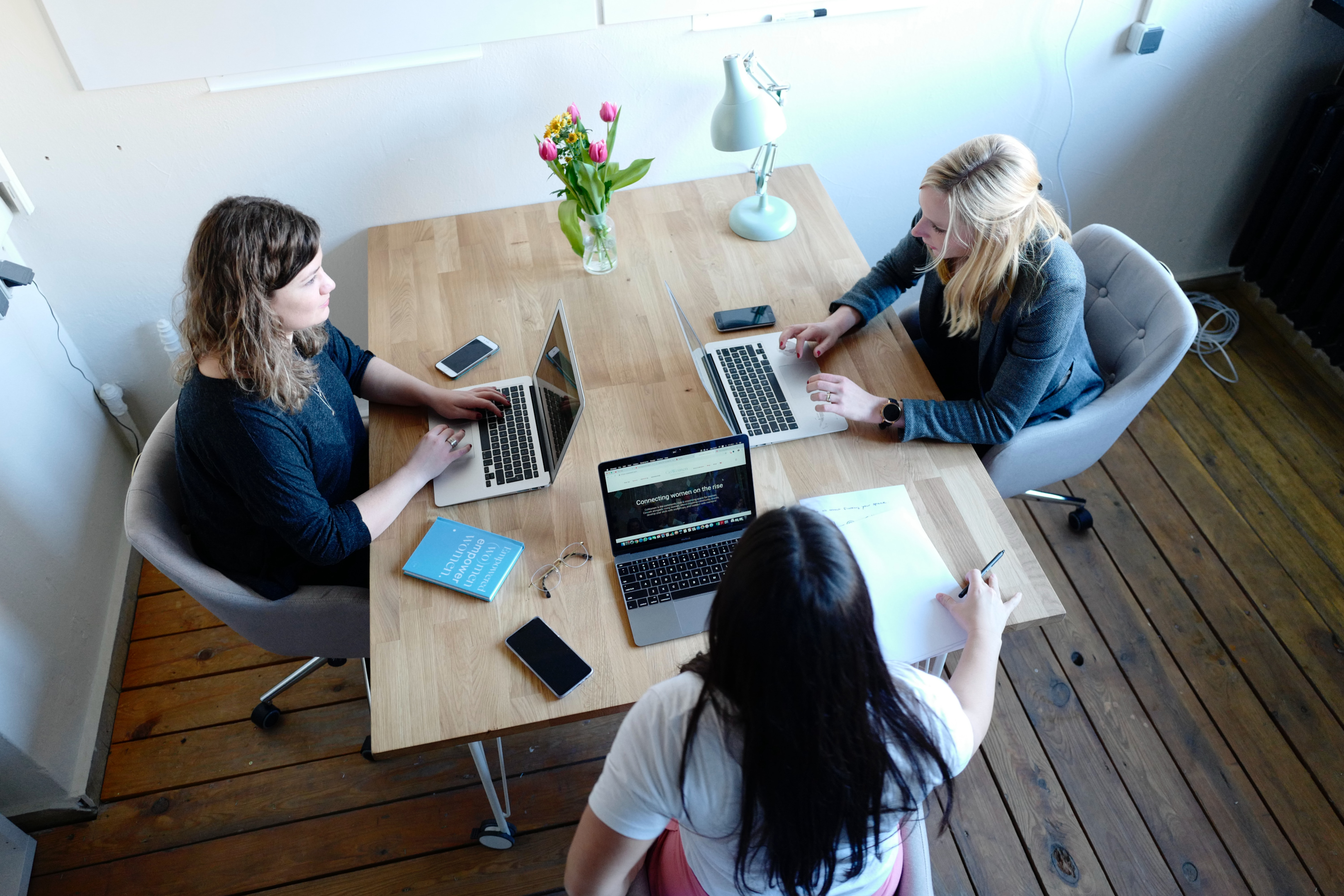 Customers in office space with desks and chairs