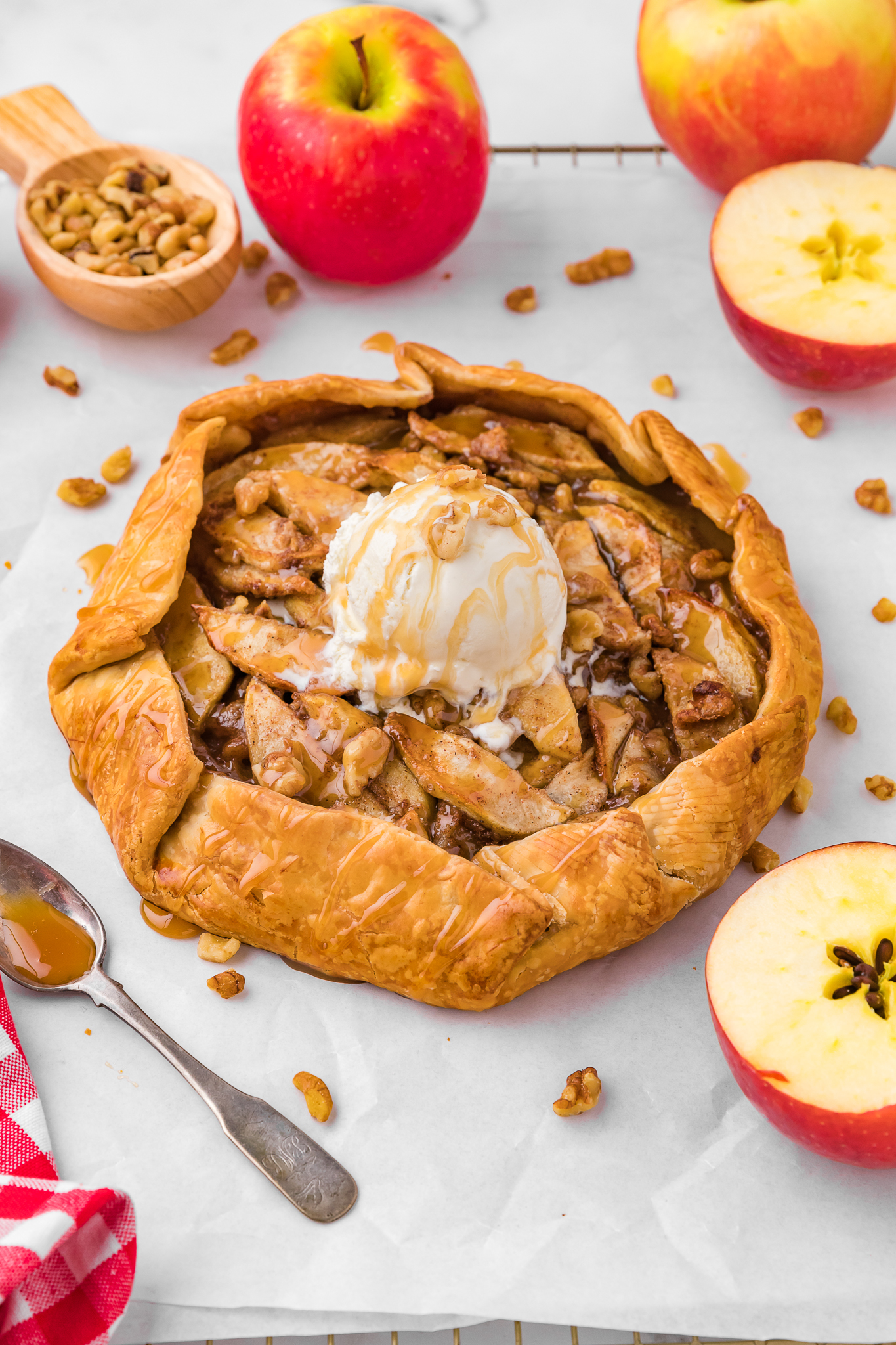 whole apple crostata topped with ice-cream and caramel
