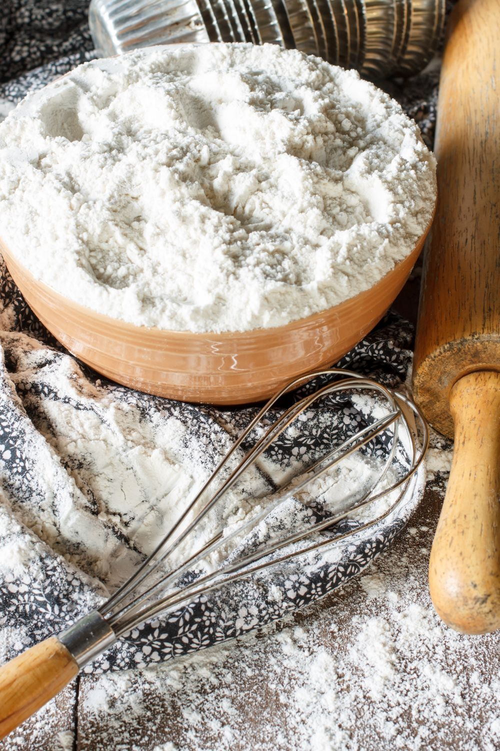 bowl of flour and a whisk