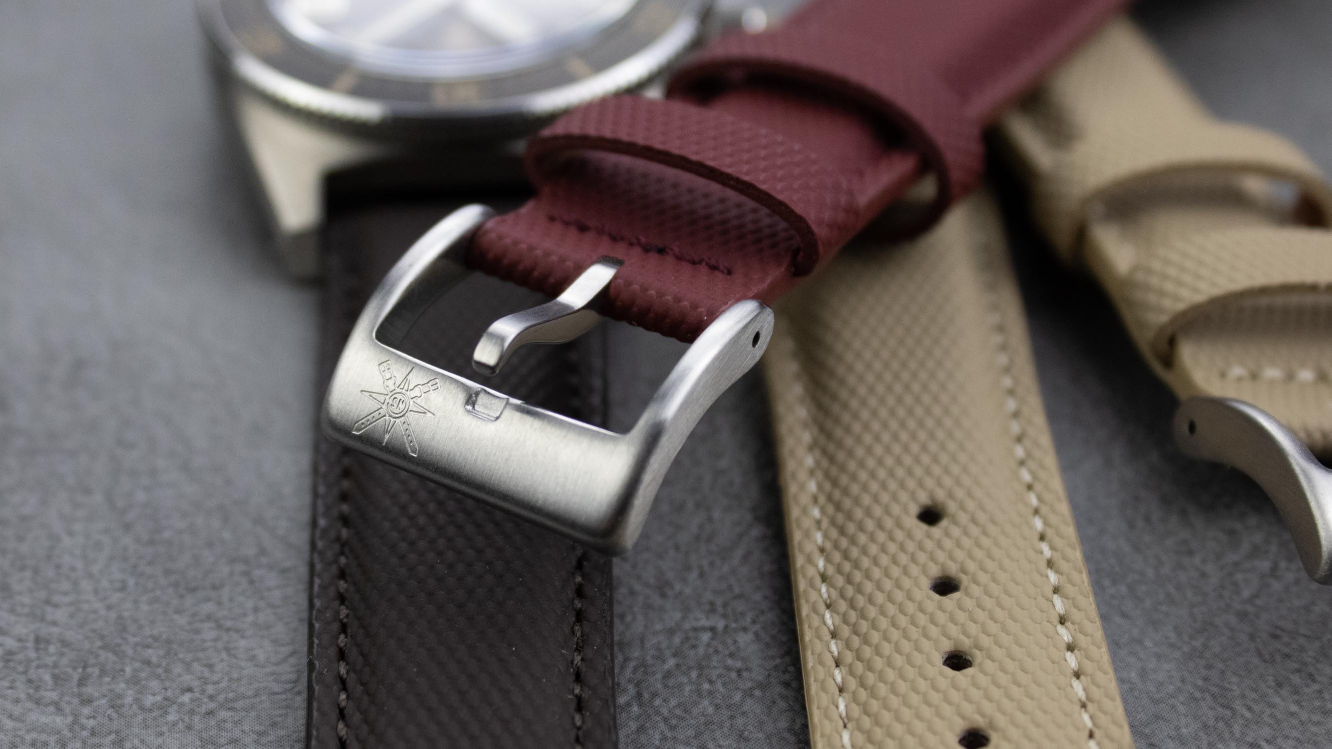 A stylish red sailcloth watch strap displayed on a wrist, demonstrating its appeal.