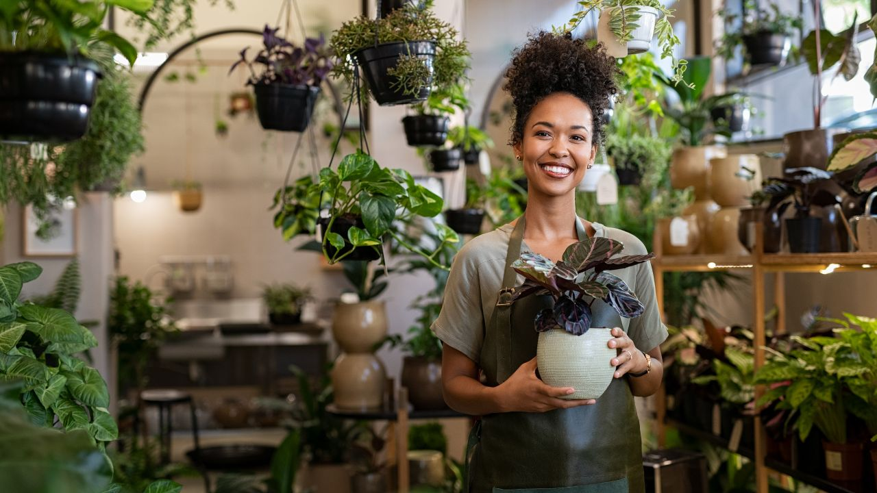 A woman setting up a Pinterest business account for her Etsy shop