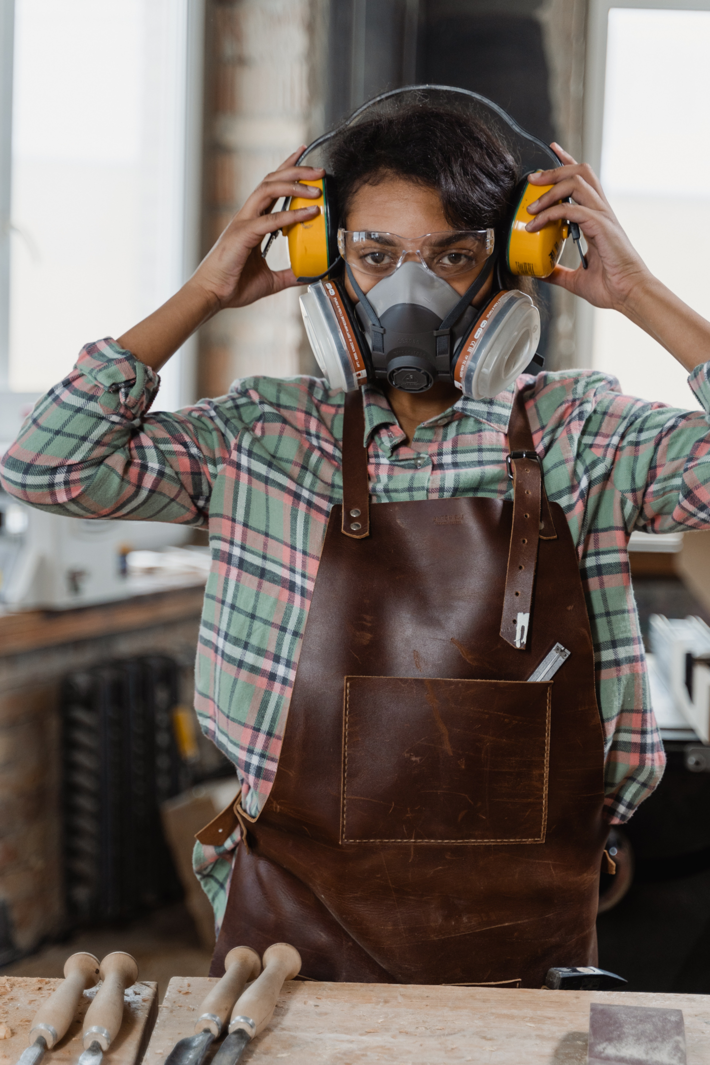 person working on wood projects wearing a respirator
