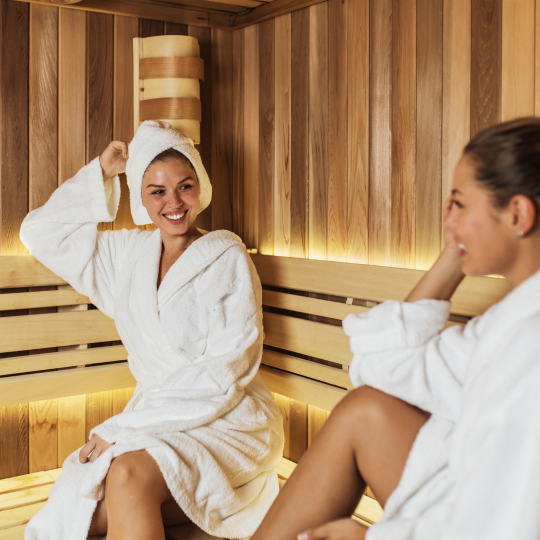 A happy group of friends getting healthy together in the sauna with improved oxygen.