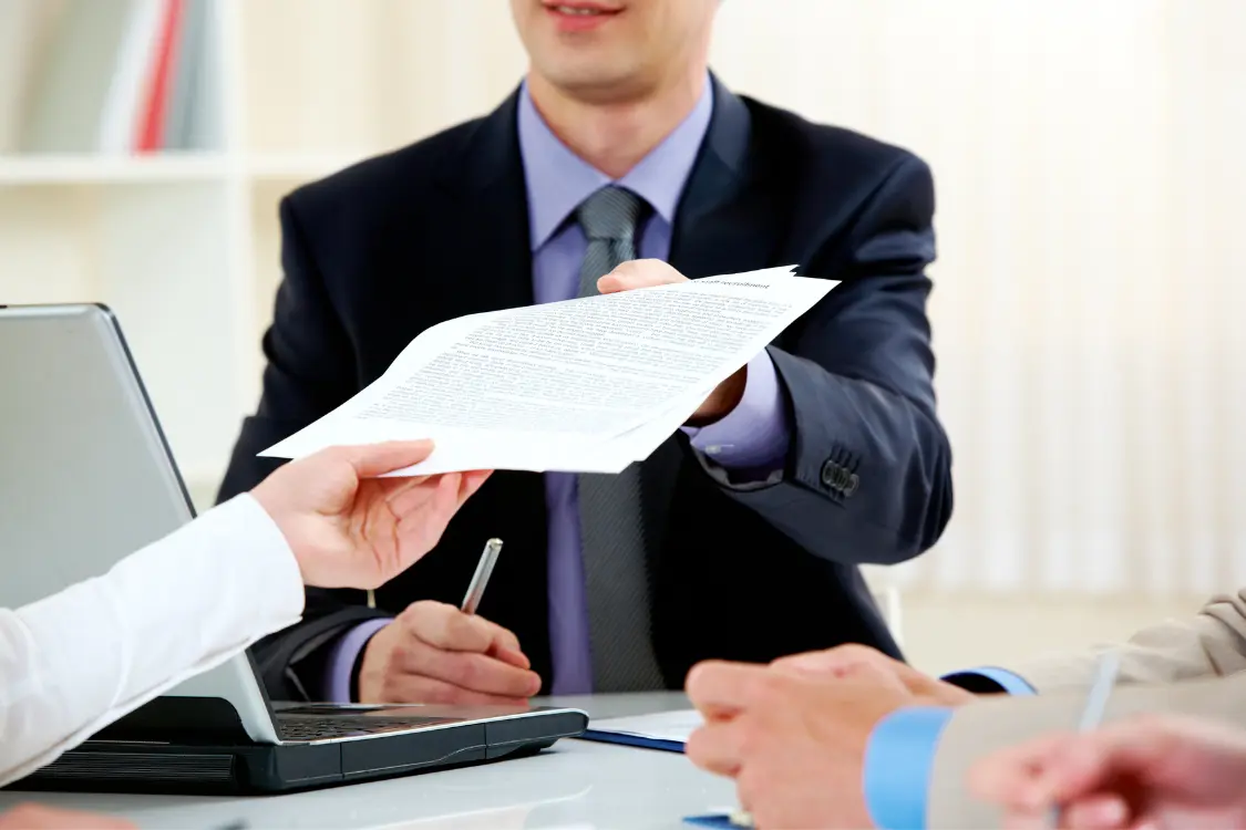 Business broker providing client references to a business owner during a sales consultation