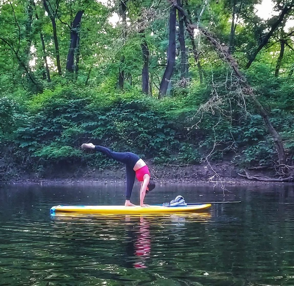 sup yoga on a stand up paddle board