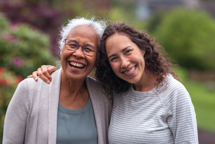 Mixed race mother and daughter out for a walk. 