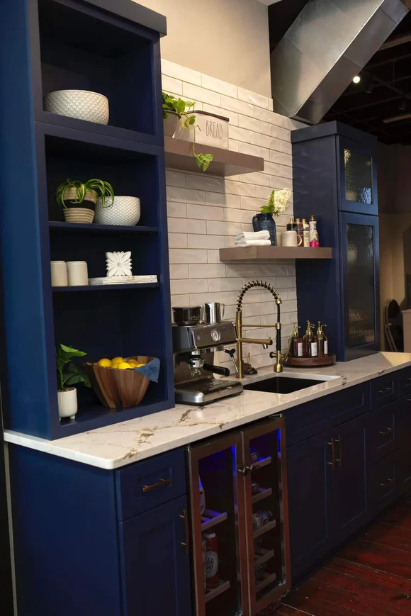 The image showcases one of our custom paint finishes in Sherwin Williams Naval. This display is designed to inspire homeowners in Greenville, SC, to create their dream kitchen with quality cabinetry that meets their expectations.