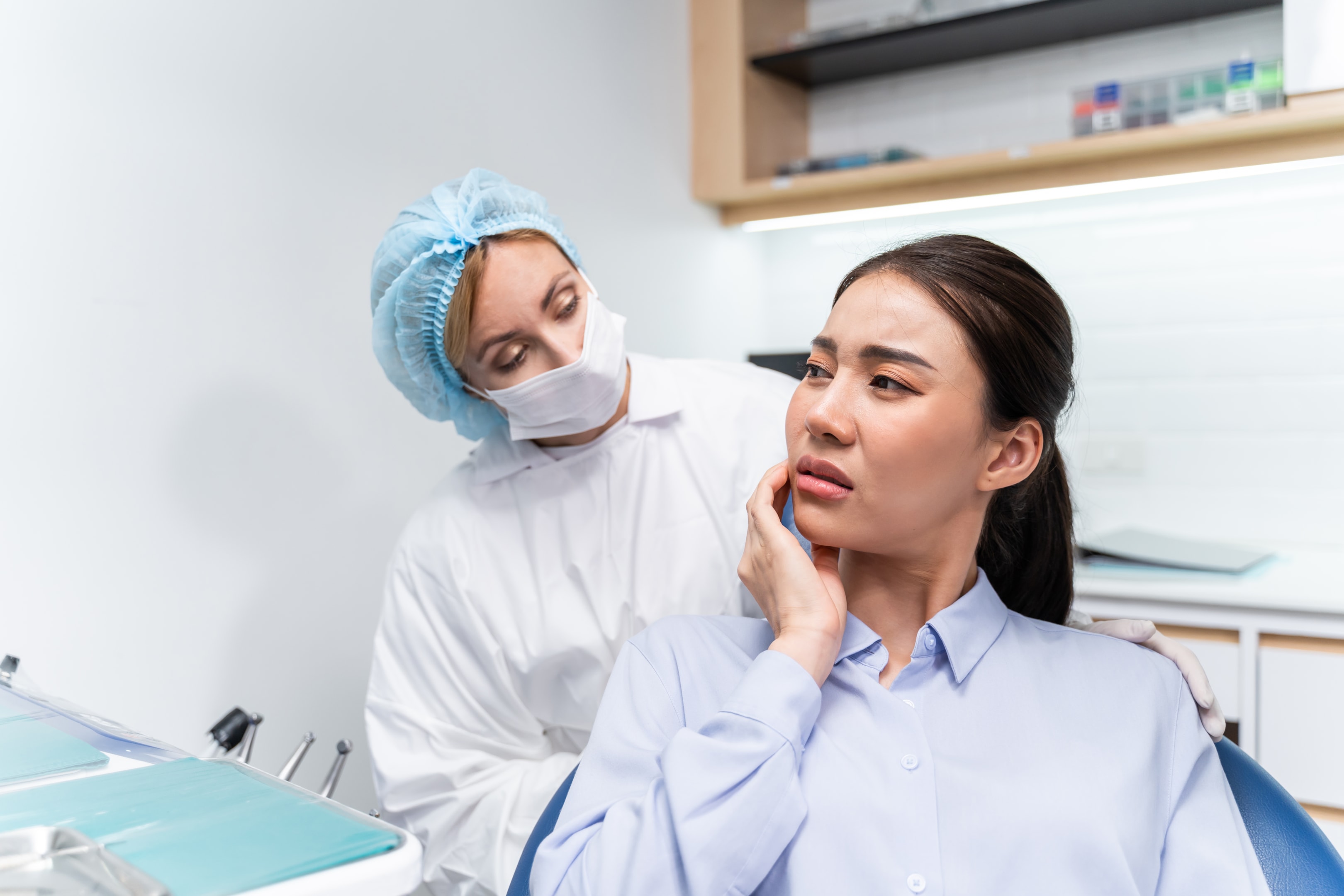 A photo of a woman that tooth may infected with harmful bacteria.