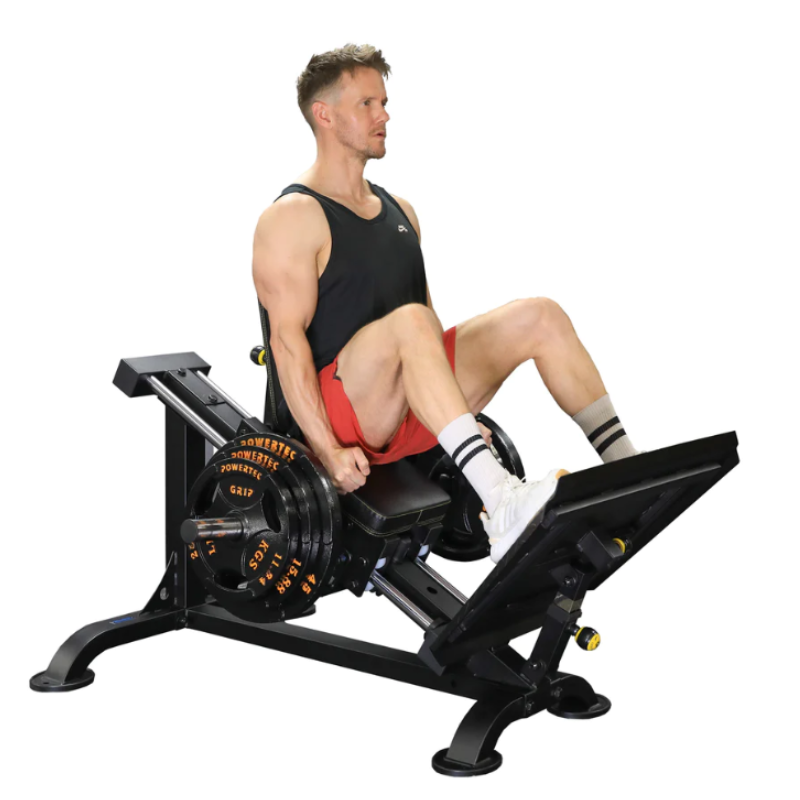 Picture of an athlete using the Powertec Compact Leg Sled in the starting position.