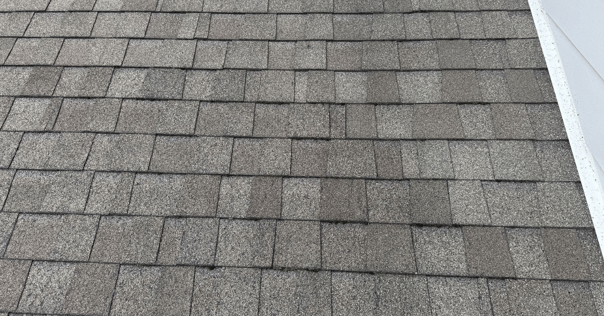 Asphalt shingle roof showing discoloration and granule loss from prolonged sun exposure and extreme heat.