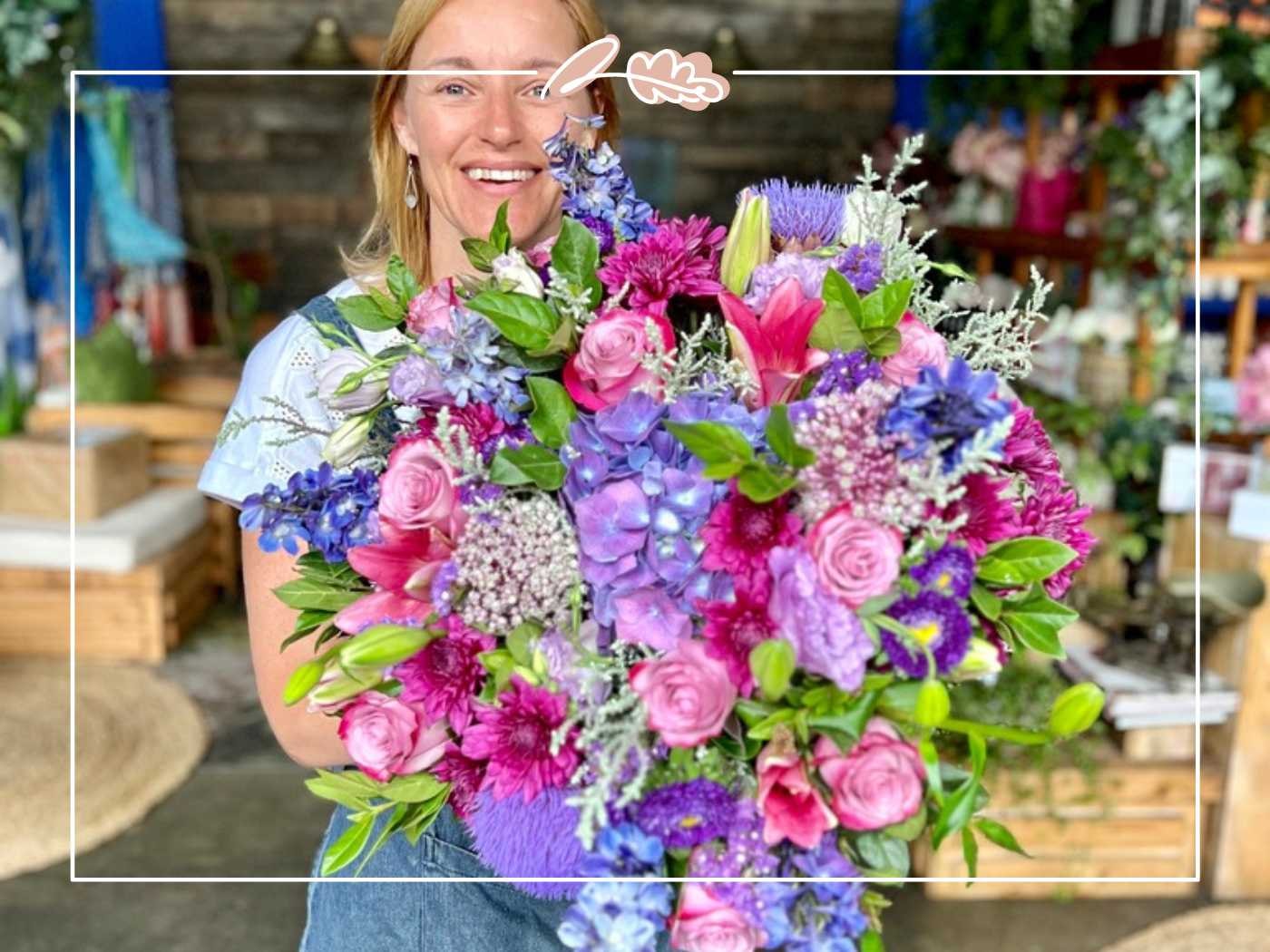 Florist holding a vibrant bouquet of flowers by Fabulous Flowers and Gifts