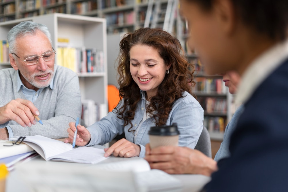 older adults discussing in a library