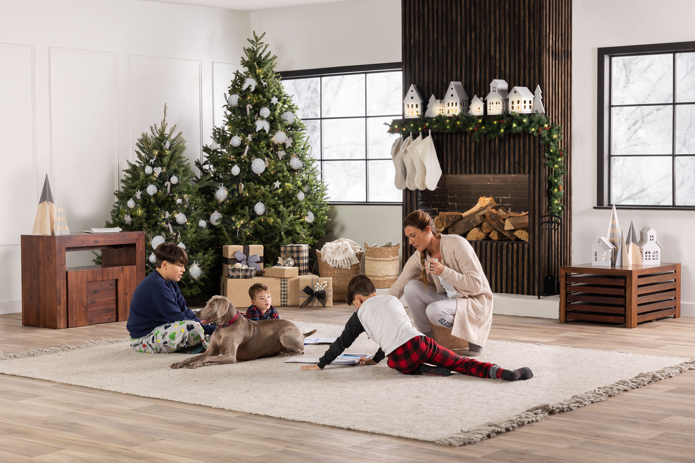 A mother and kids on Christmas days in the family living room