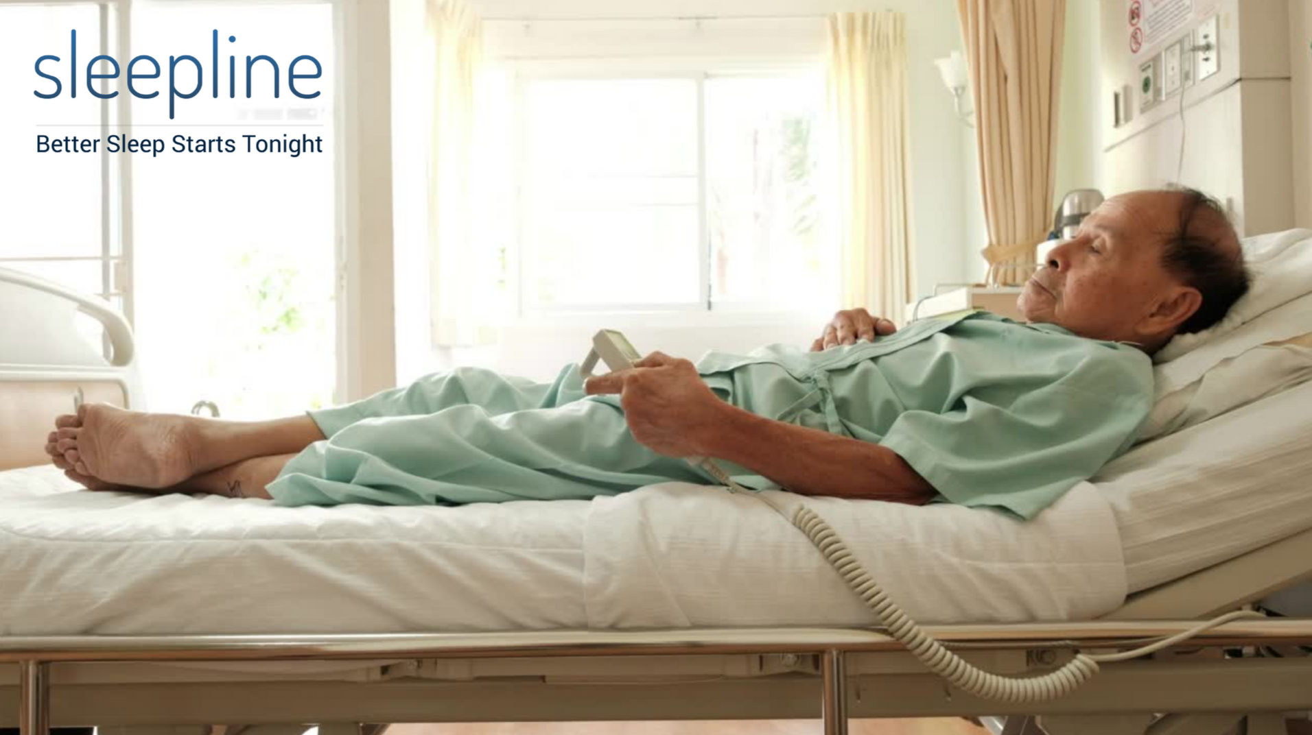 Elderly man laying on an adjustable bed 