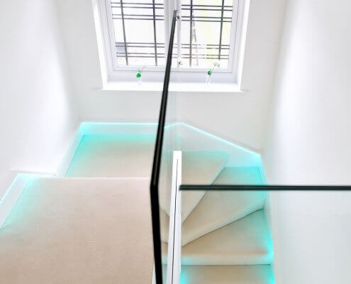  minimalistic glass staircase, combined with subtle LED light strips