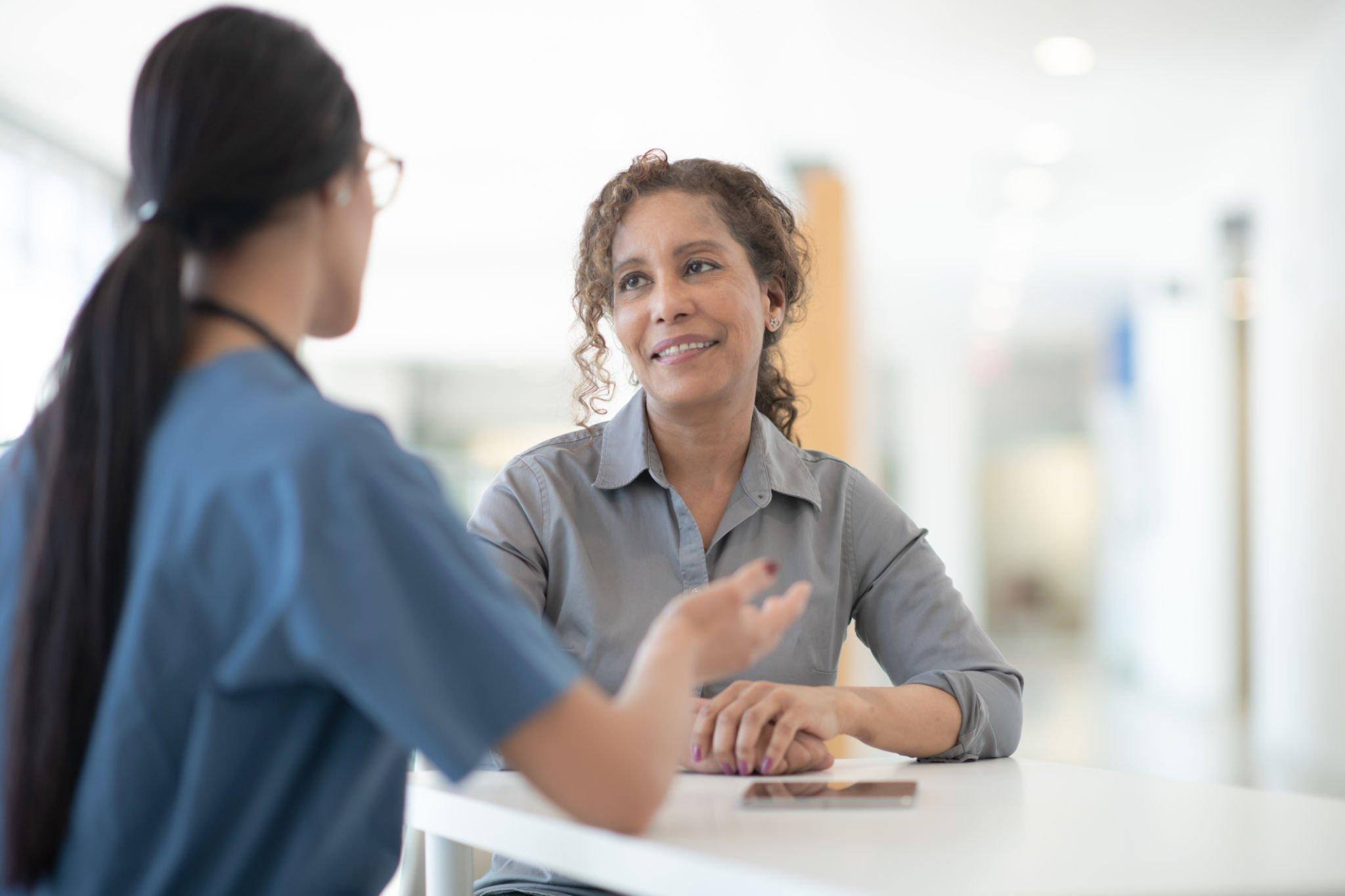 A person consulting with a medical professional.