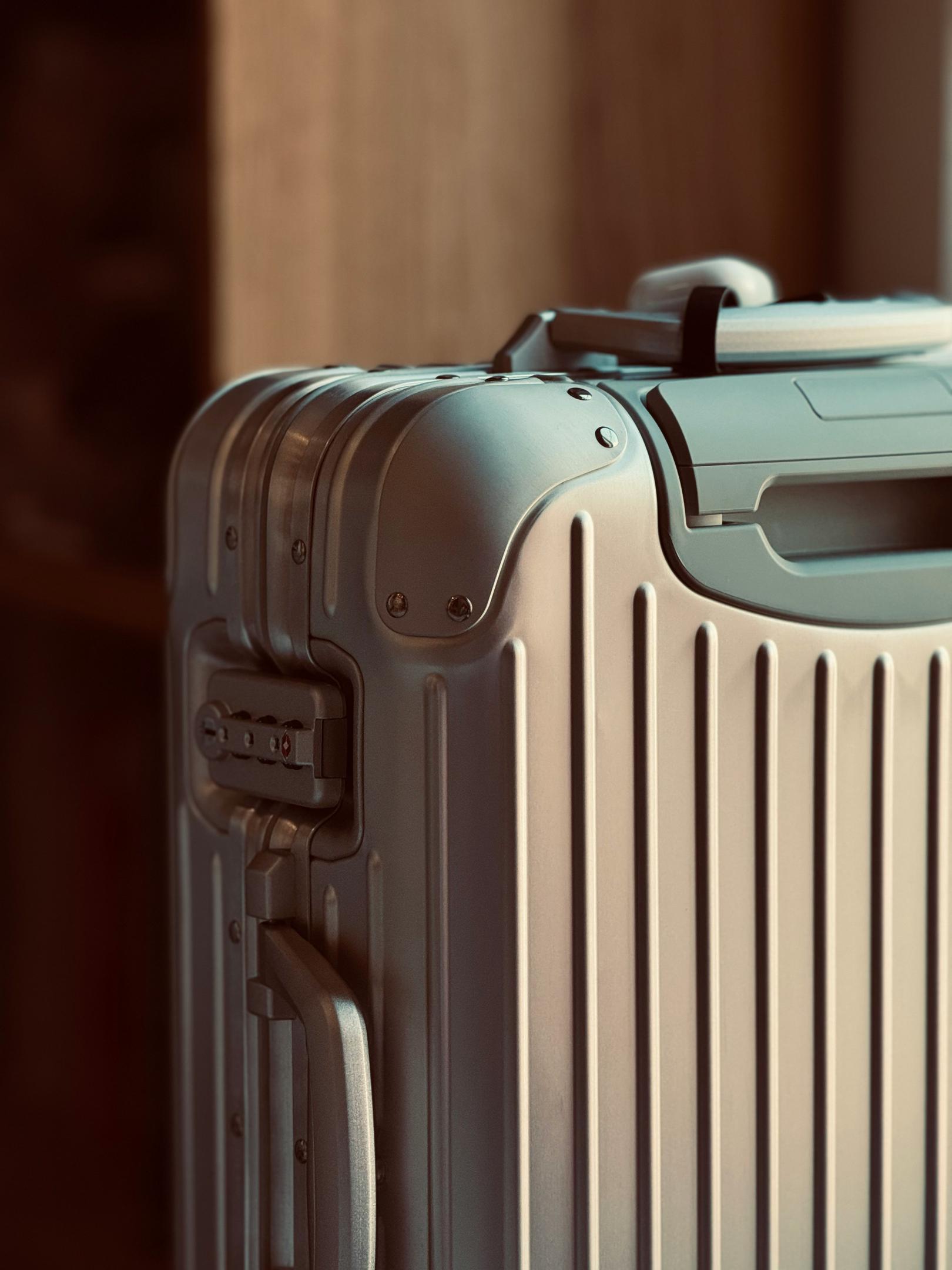 Close-up of a polycarbonate hardshell suitcase with vertical grooves.