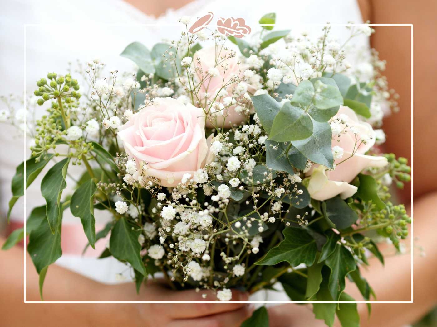 A close-up shot of a bride holding a delicate bouquet of pale pink roses, baby's breath, and eucalyptus leaves. Fabulous Flowers and Gifts.