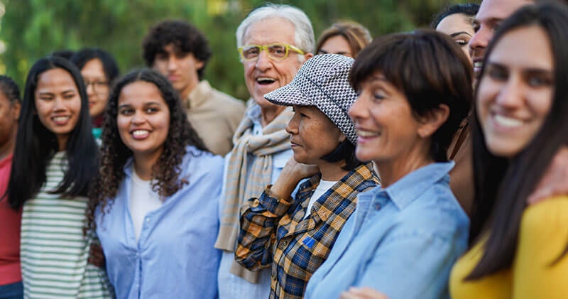 A diverse group of people representing resilient people developing strength and adaptability together.