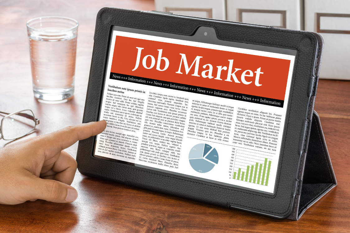 Digital tablet showing job market trends and employment news