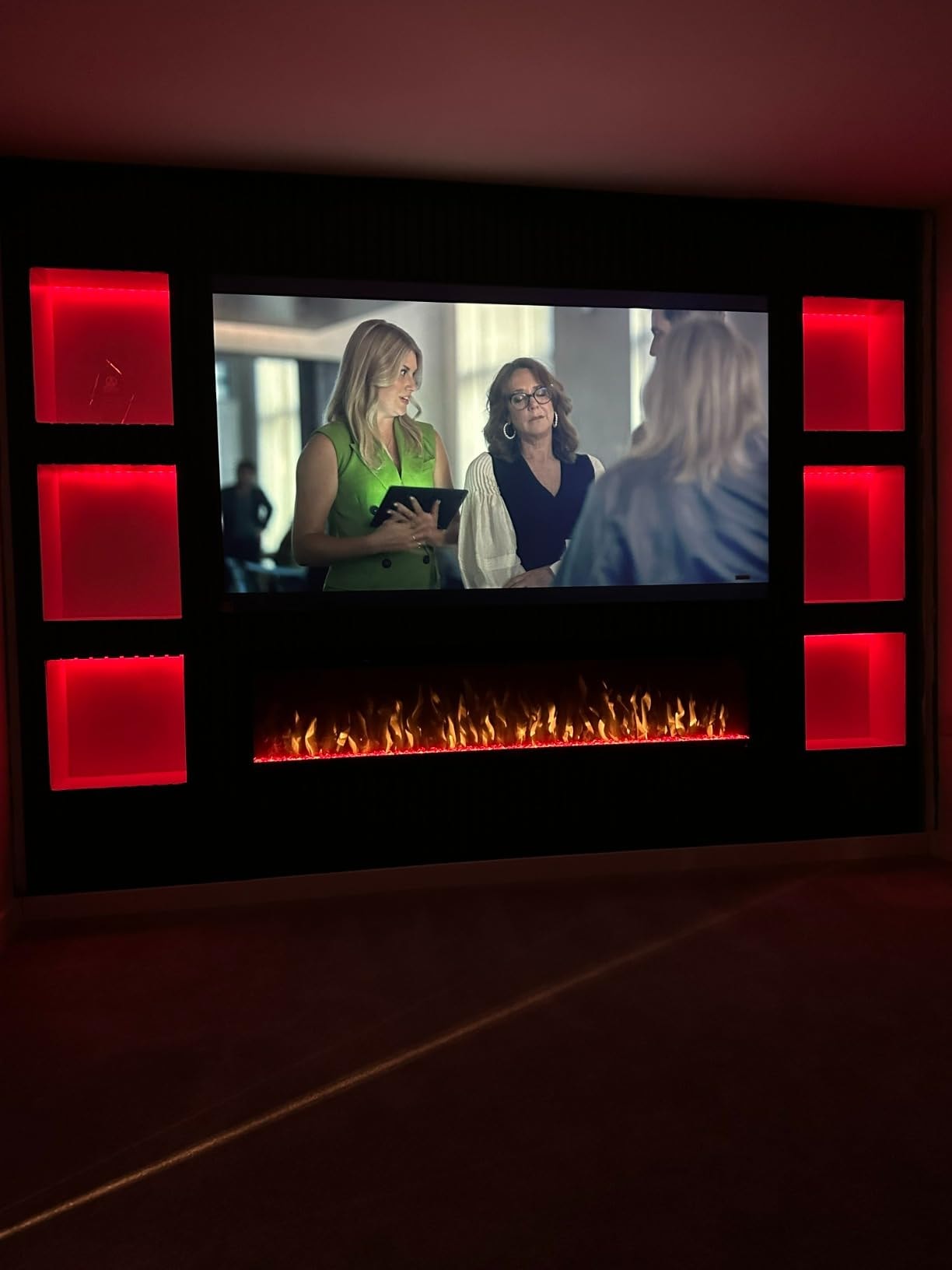 Different types of media wall fireplaces displayed in a modern setting.