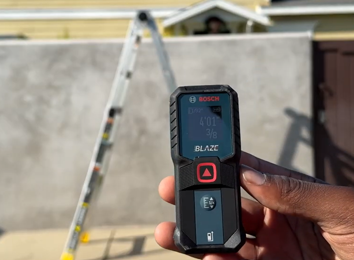 Bosch laser measure being dropped from ladder