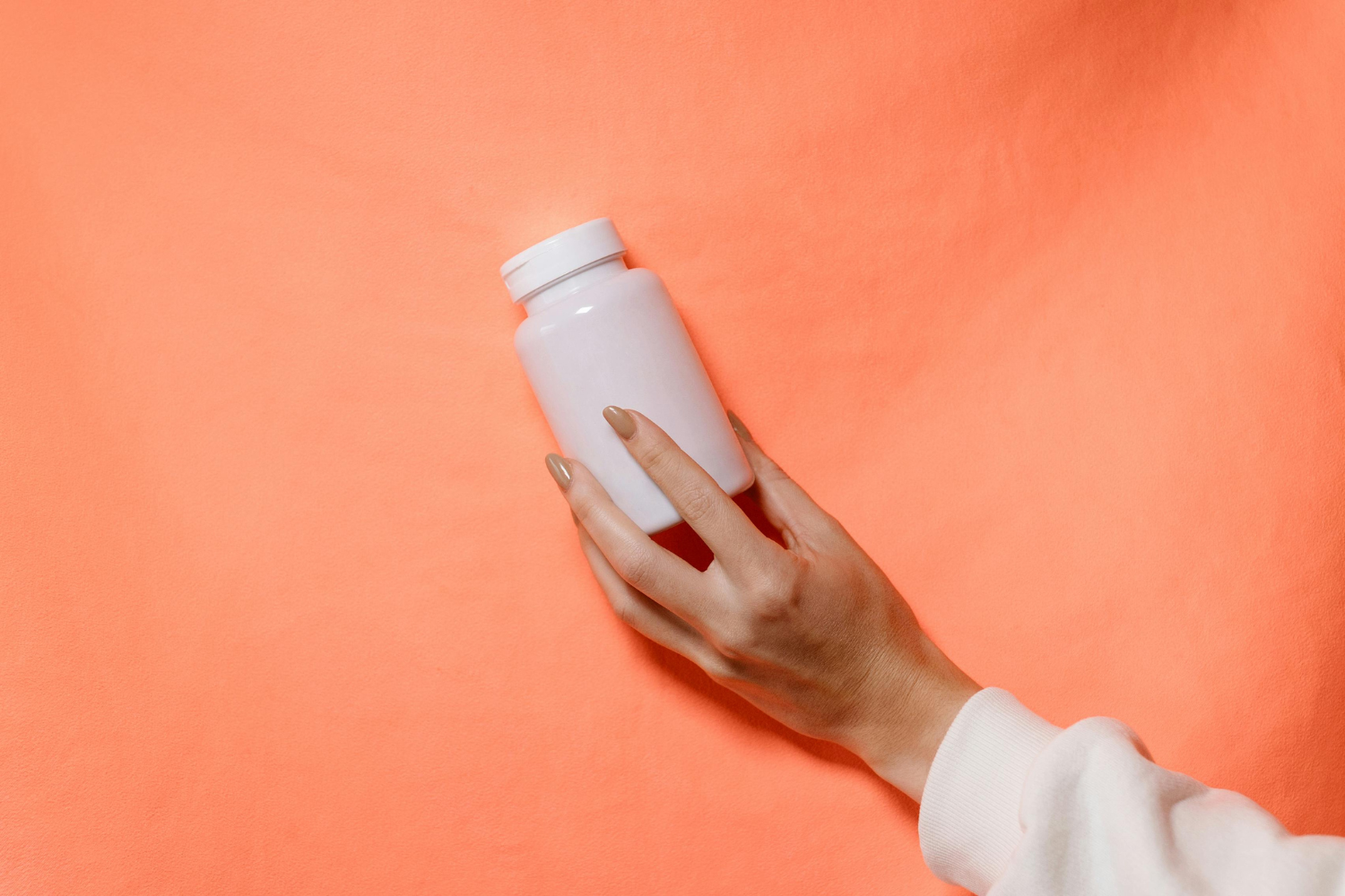 A blank supplement bottle.