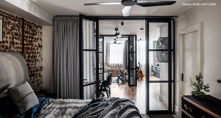 An industrial style bedroom that looks into a living space. Photo sourced from Houzz.com and Studio Del Castillo.