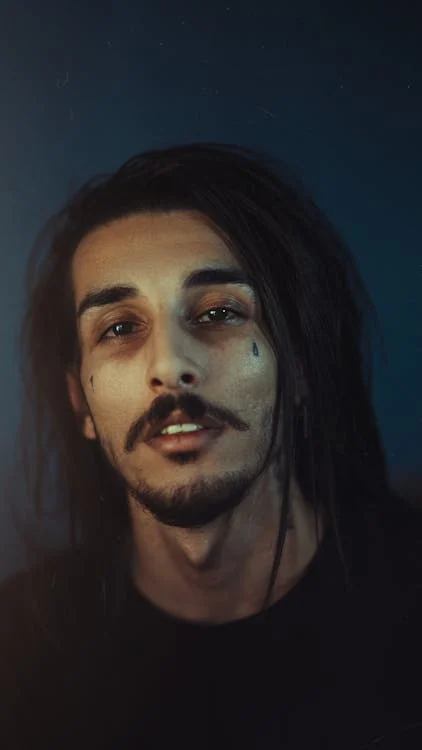 Teardrop Tattoo Meaning: What Does It Mean? 2 Man with teardrop tattoo - tear tattoos can sometimes be found on family members of people who have been incarcerated.