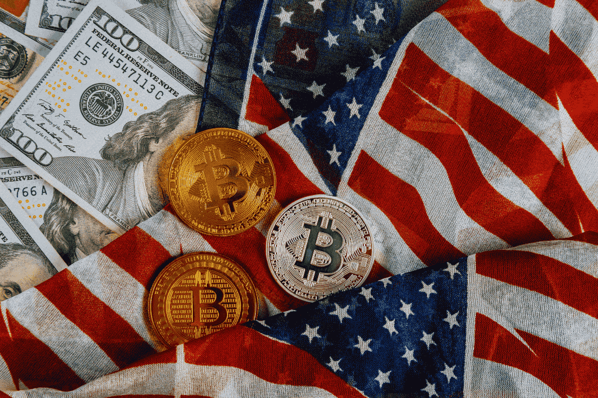 USA flag, currency and Bitcoin coins