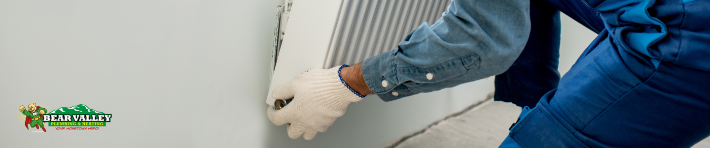 A service technician demonstrating how to get relief pressure for a radiant system back to operating pressure. 