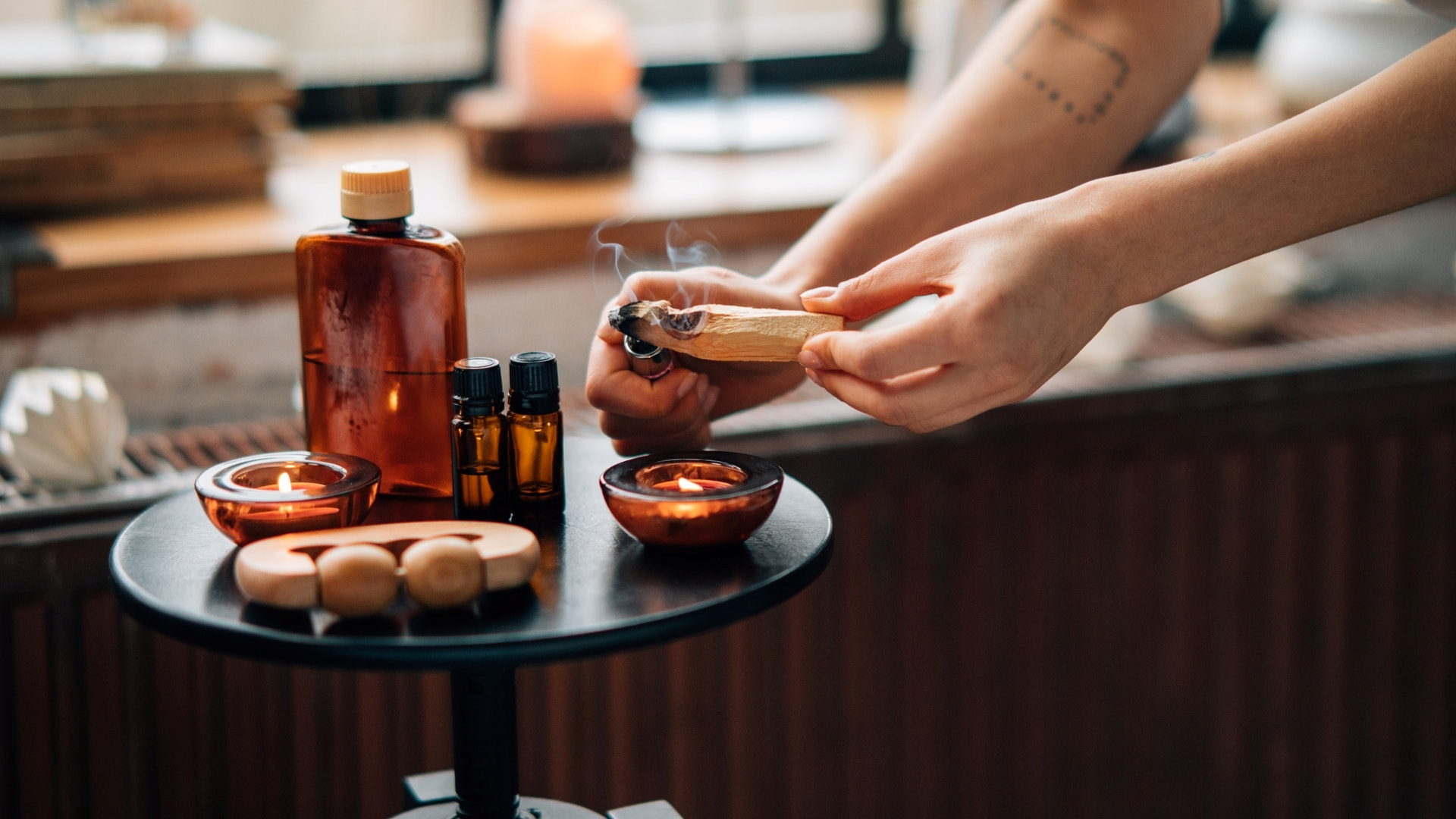 woman preparing aromatherapy for a spa day