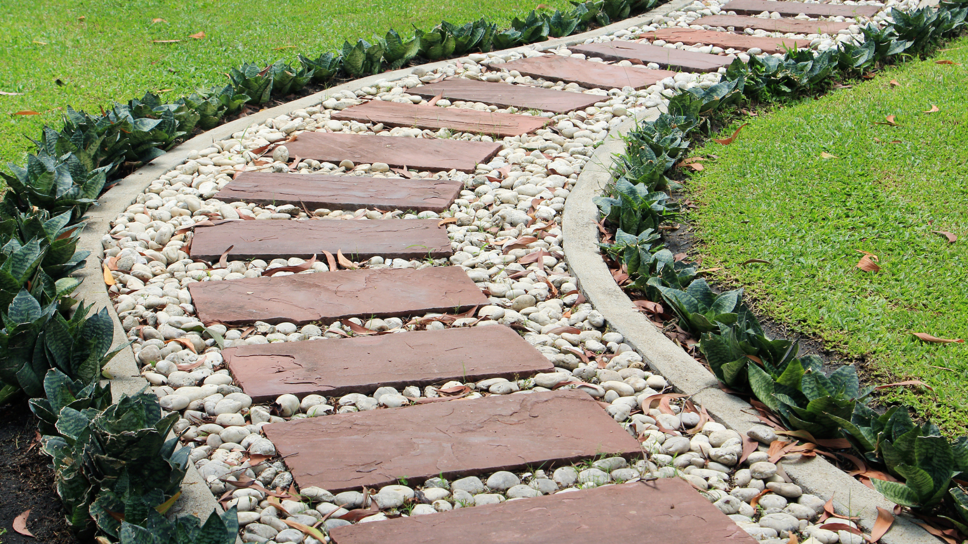 A walkway with river stones, used to control weeds. 