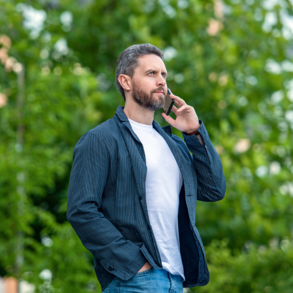 An image of a person carefully speaking on the phone with an insurance representative.