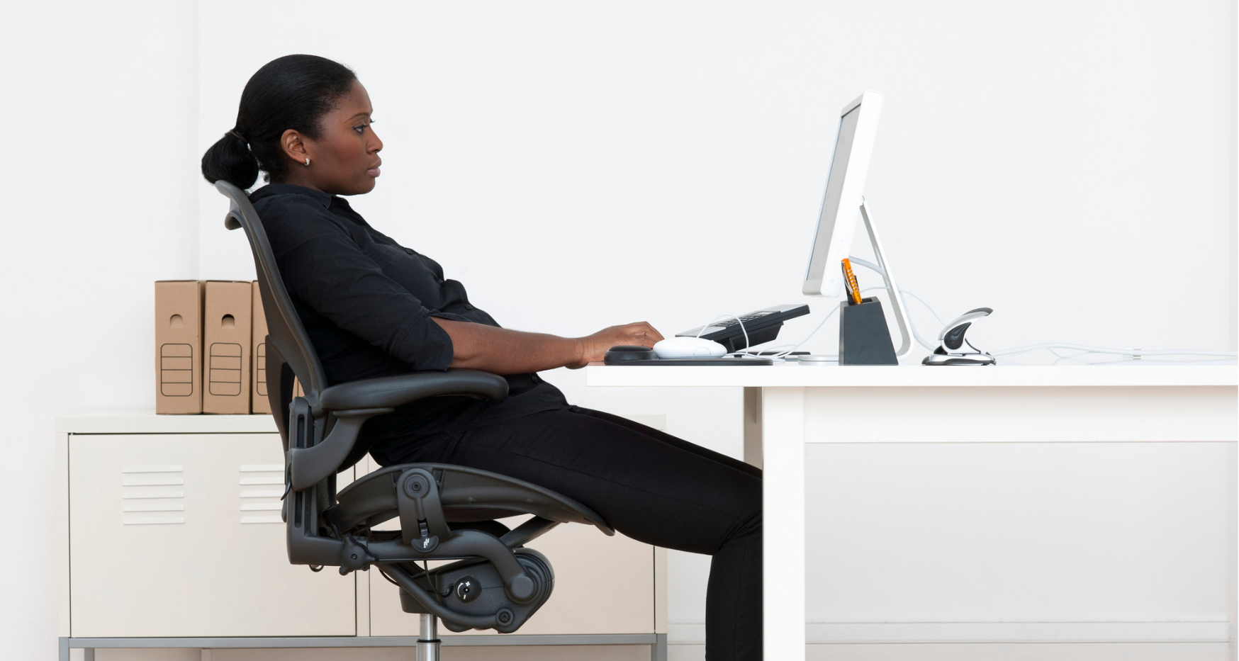 Woman leaning back on chair as back support for back pain