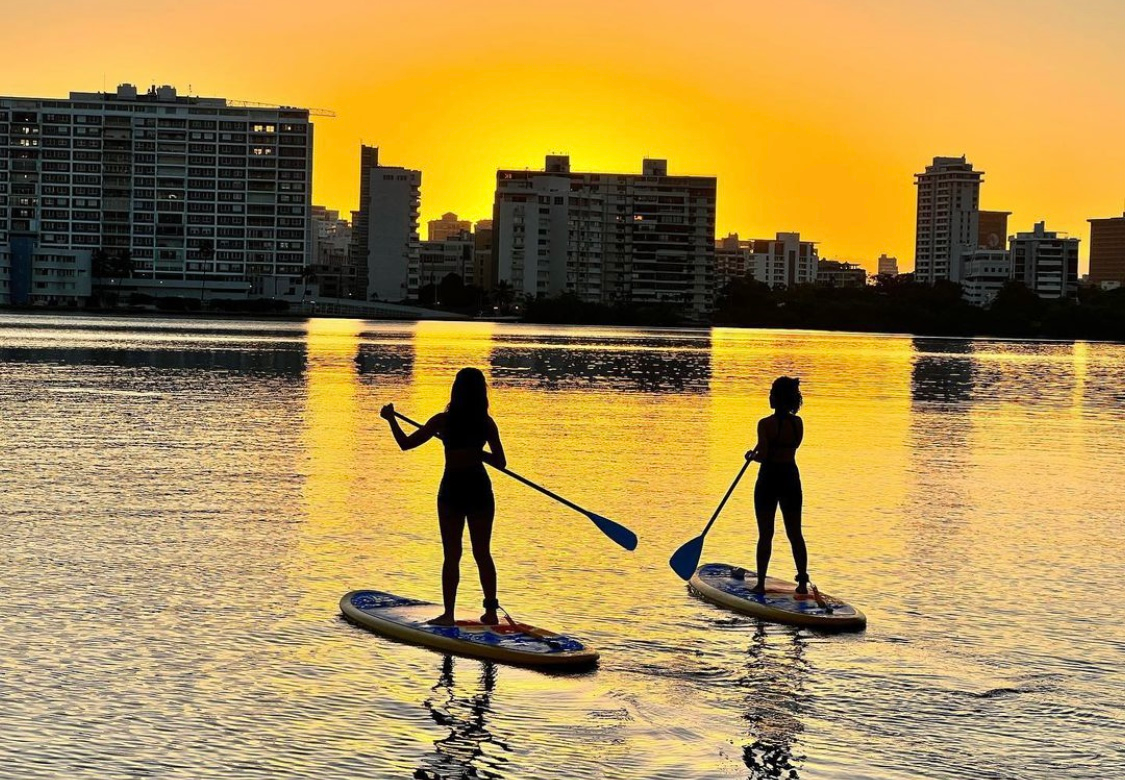 women on paddle boards