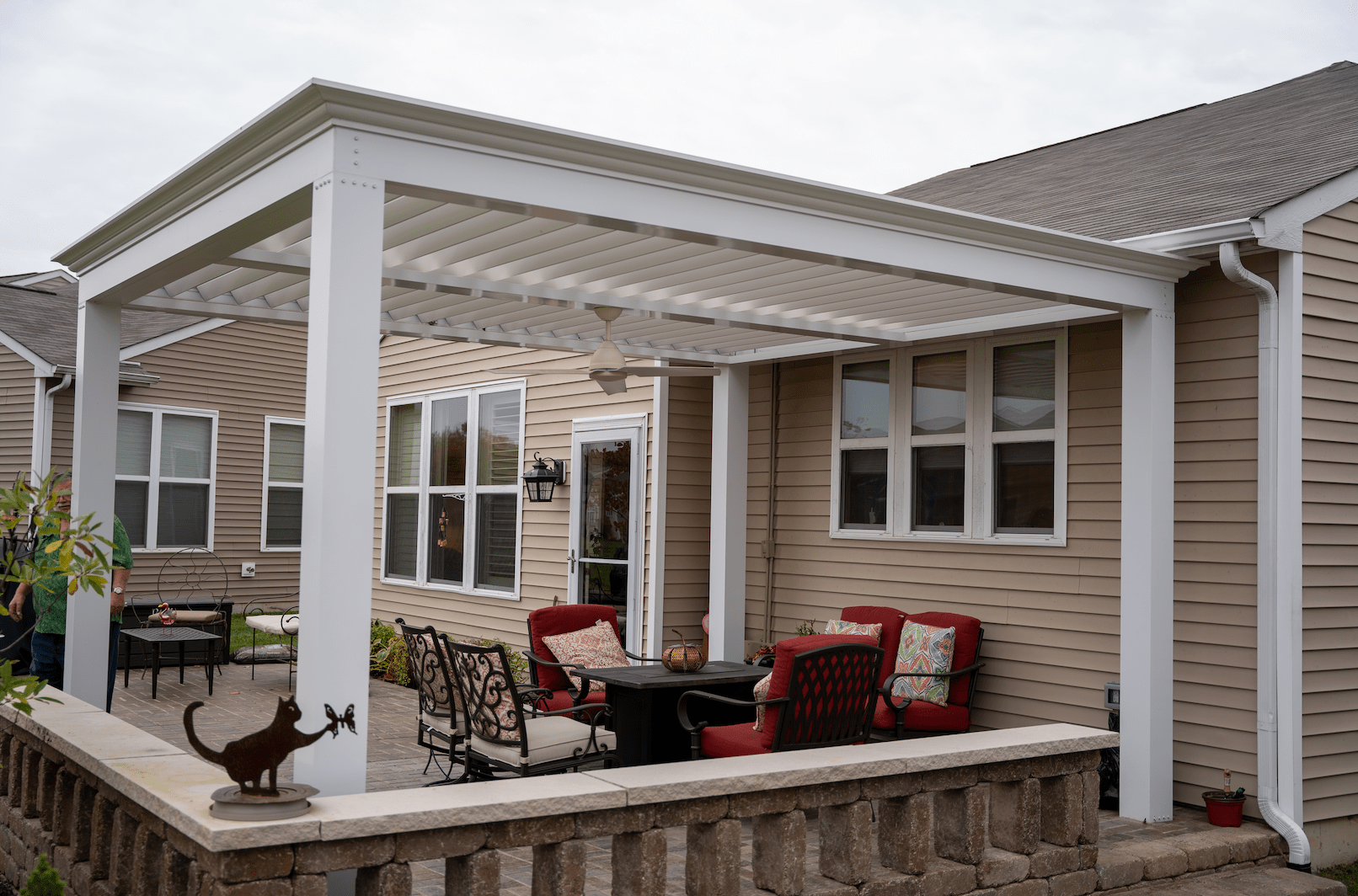 pergola install near roof of house on patio deck space