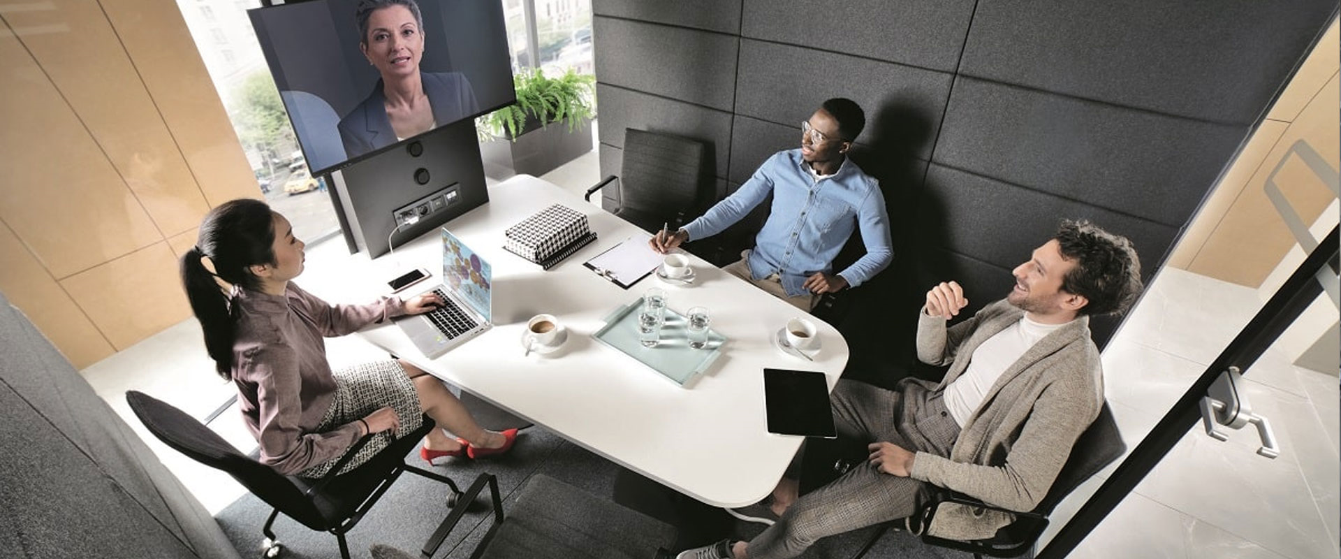 An image showing a group of people inside an office pod, demonstrating how to use office pods for brainstorming sessions