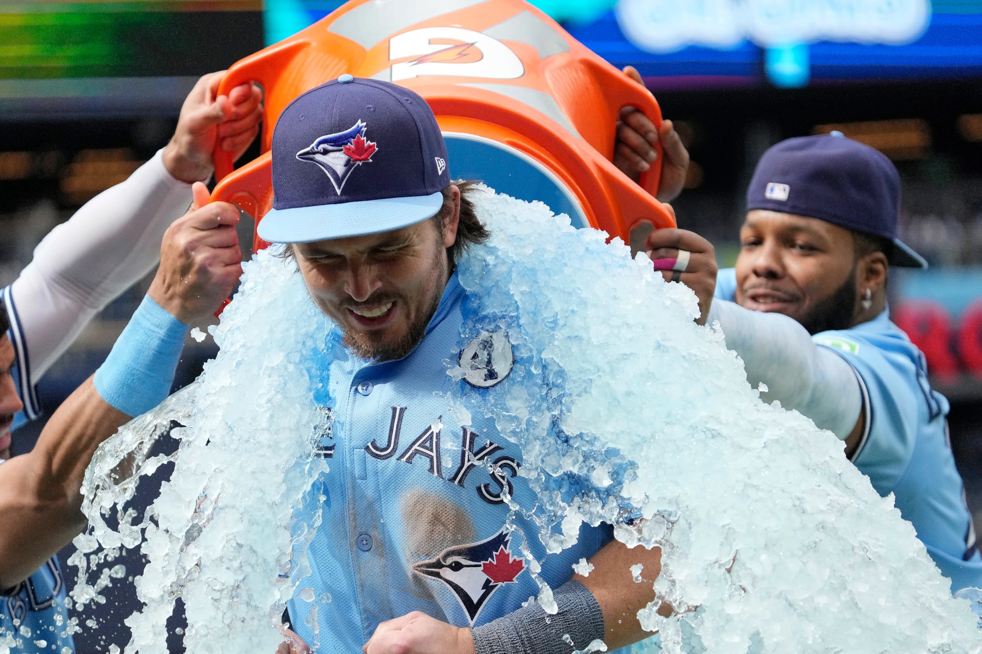 Jun 1, 2025; Toronto, Ontario, CAN; Toronto Blue Jays third baseman Addison Barger (47) reacts after being doused with ice water after a win and series sweep over the Athletics at Rogers Centre.
