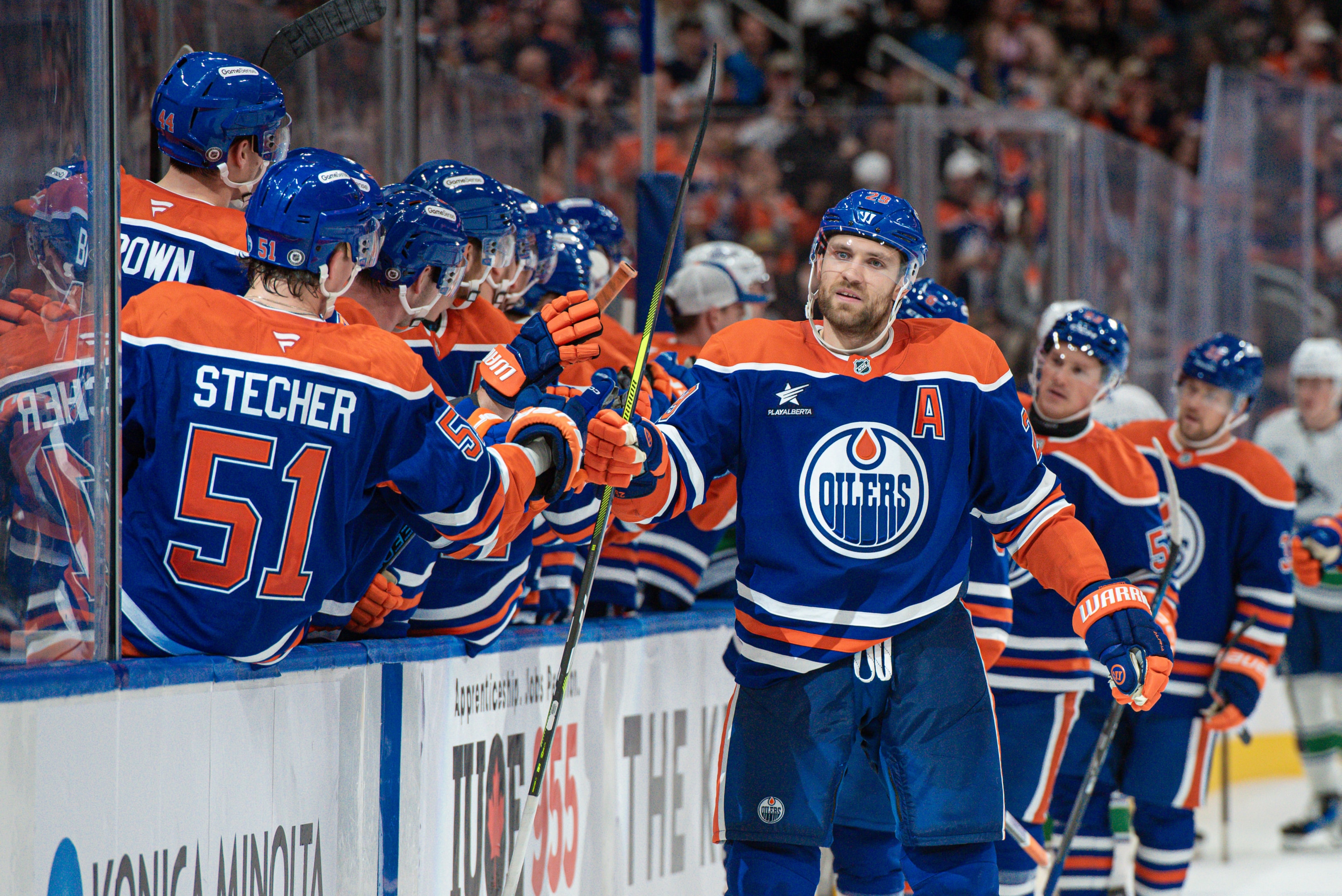  Leon Draisaitl of the Edmonton Oilers celebrates his third-period goal at the bench in a preseason game against the Vancouver Canucks at Rogers Place on September 30, 2024, in Edmonton, Alberta, Canada. 