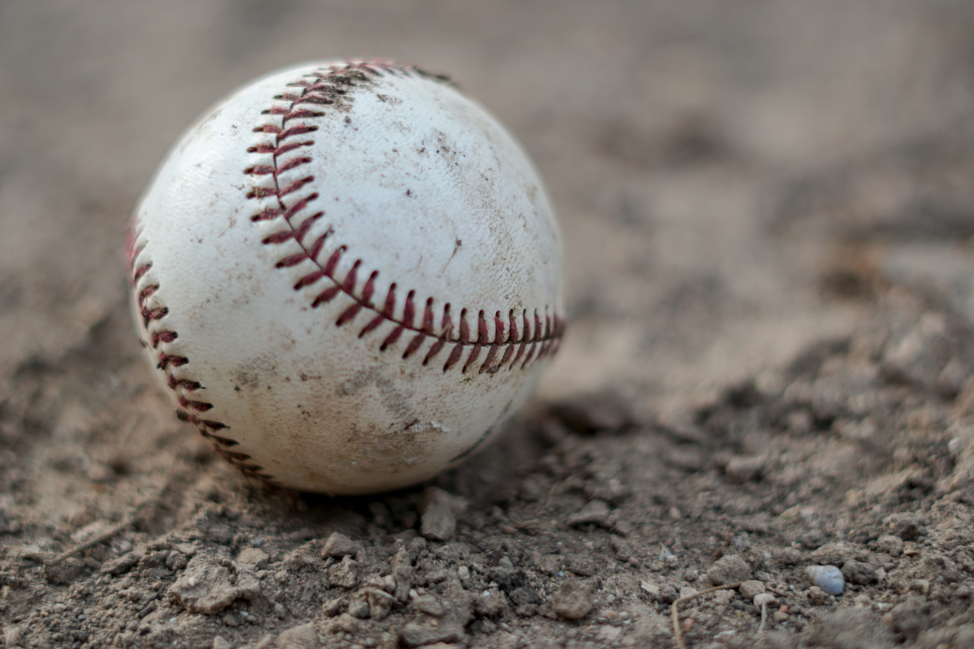 A baseball in the mud