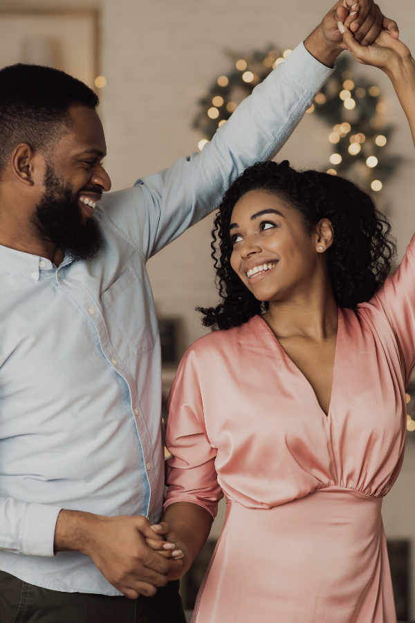 a man and women dance (masculine and feminine energy)