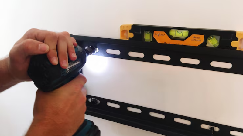 A man is applying LED narrow strips in small area easily