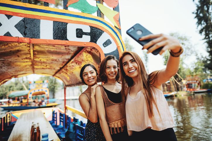 Three friends snapping a selfie. 