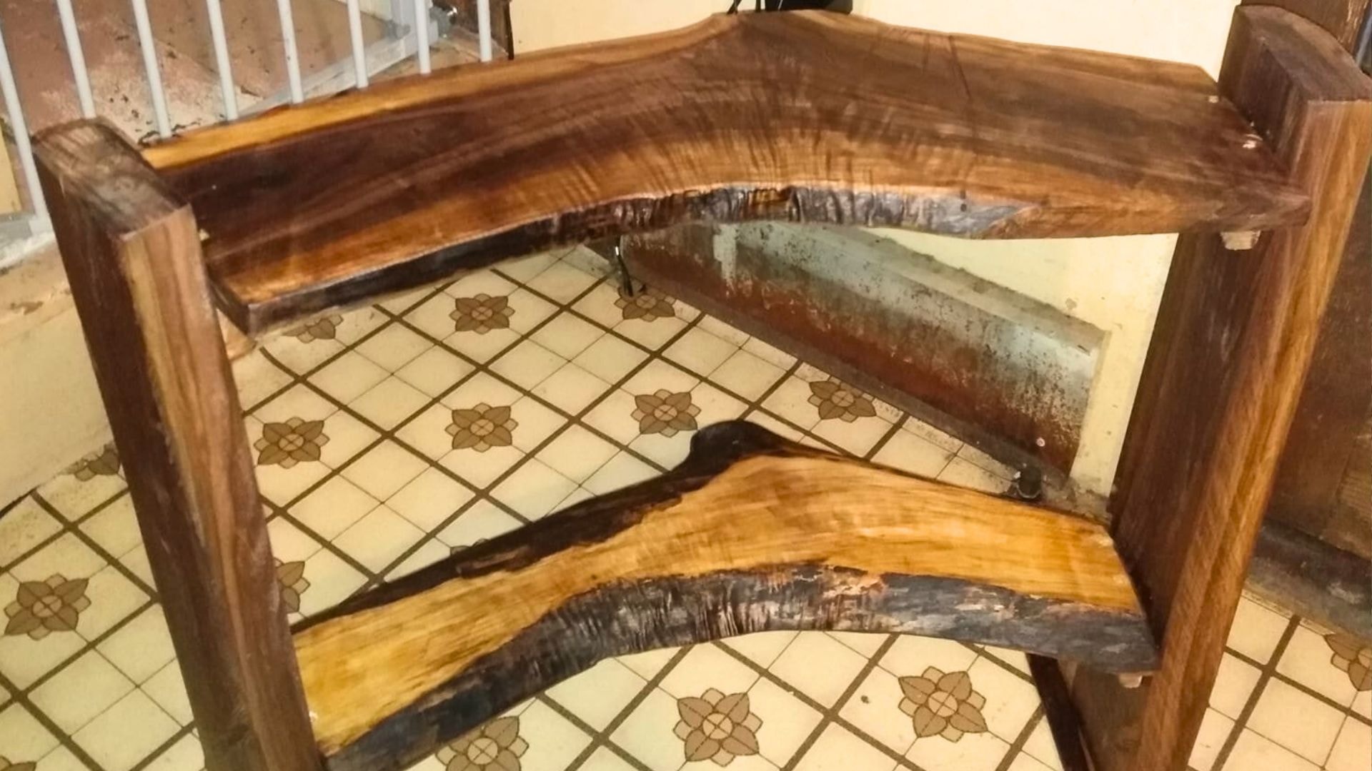 A corner shelf made with curved live-edge slabs.